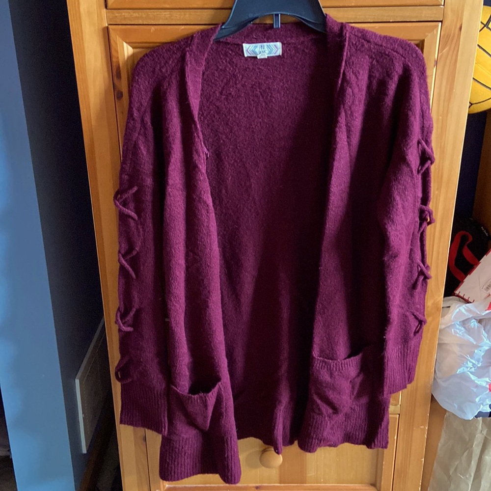 Warm maroon cardigan perfect for dressing up a casual outfit.
